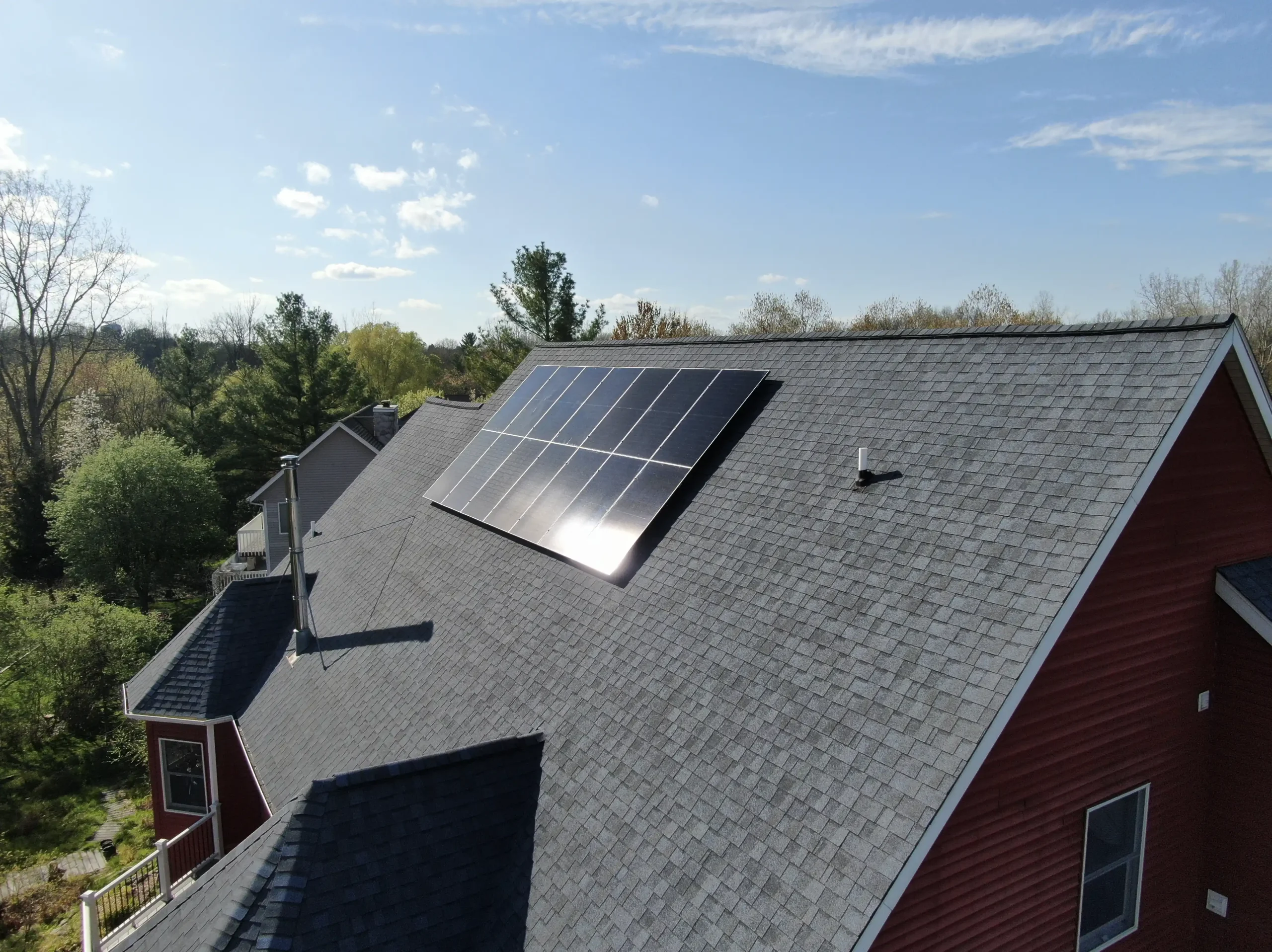 large solar panel on shingle roof scaled