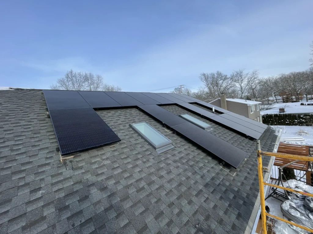 Roof mount solar panels on shingles with skylight cut outs