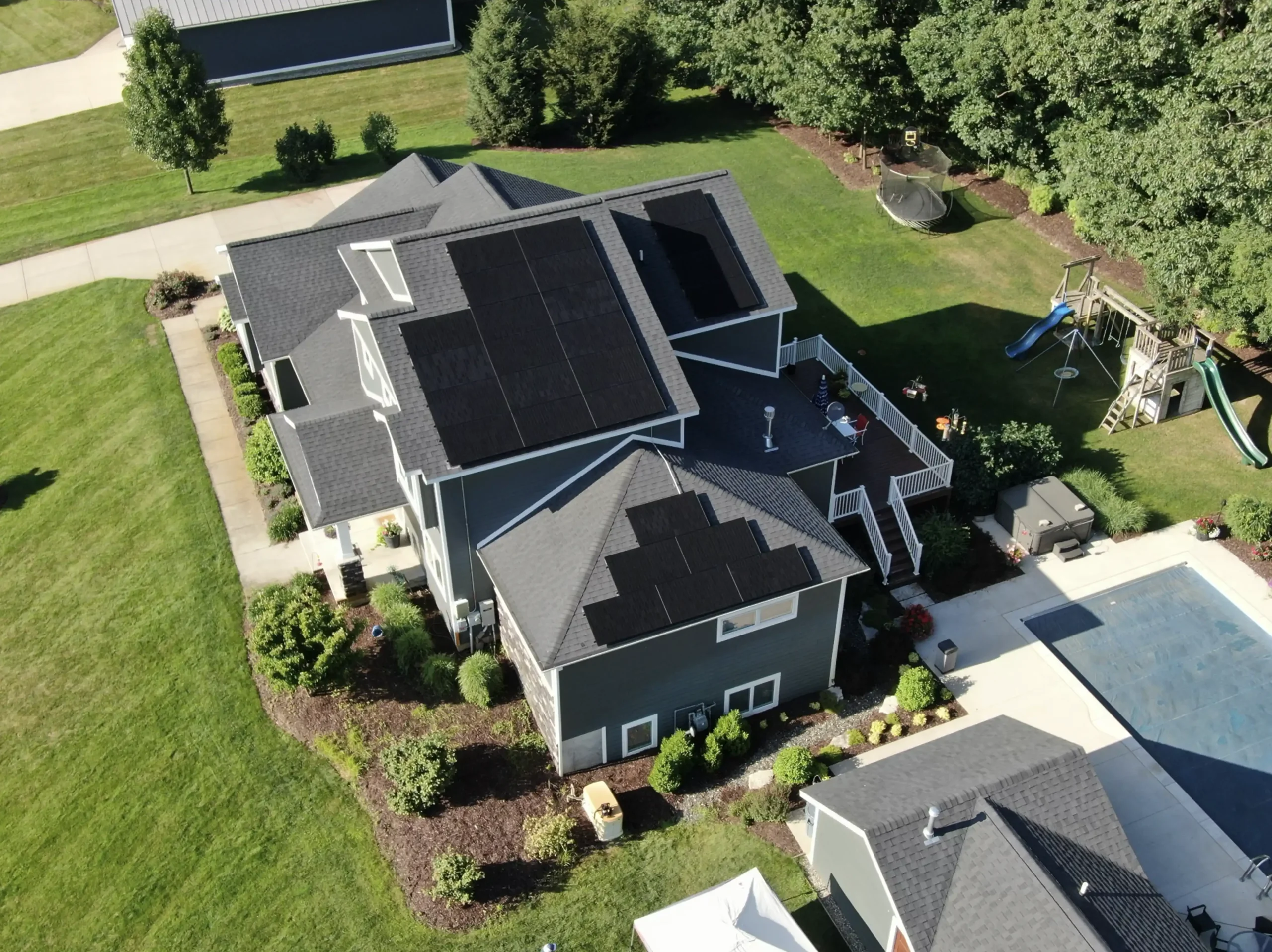 several solar panel groups on large house scaled