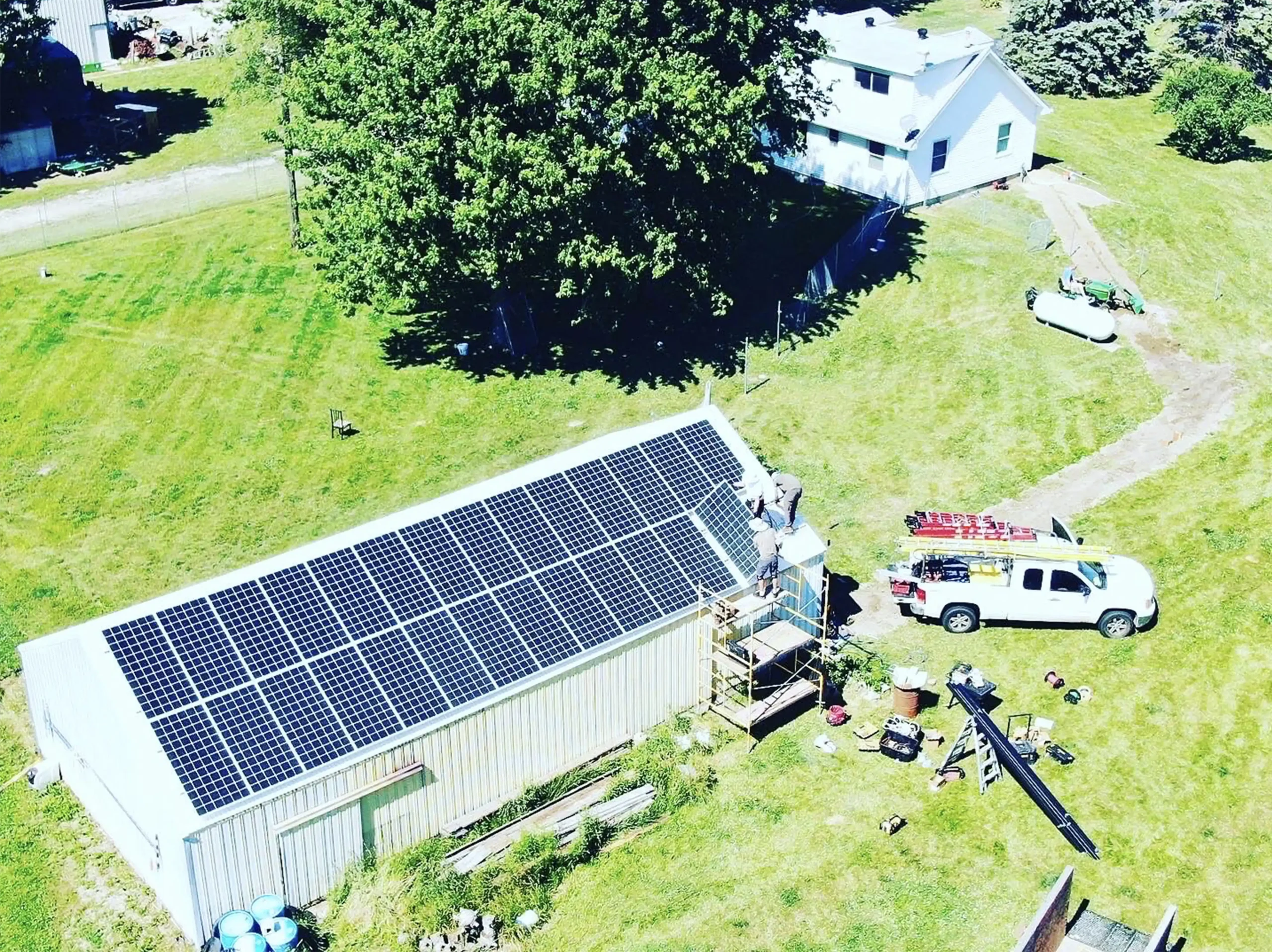 solar panels being installed on pole barn scaled