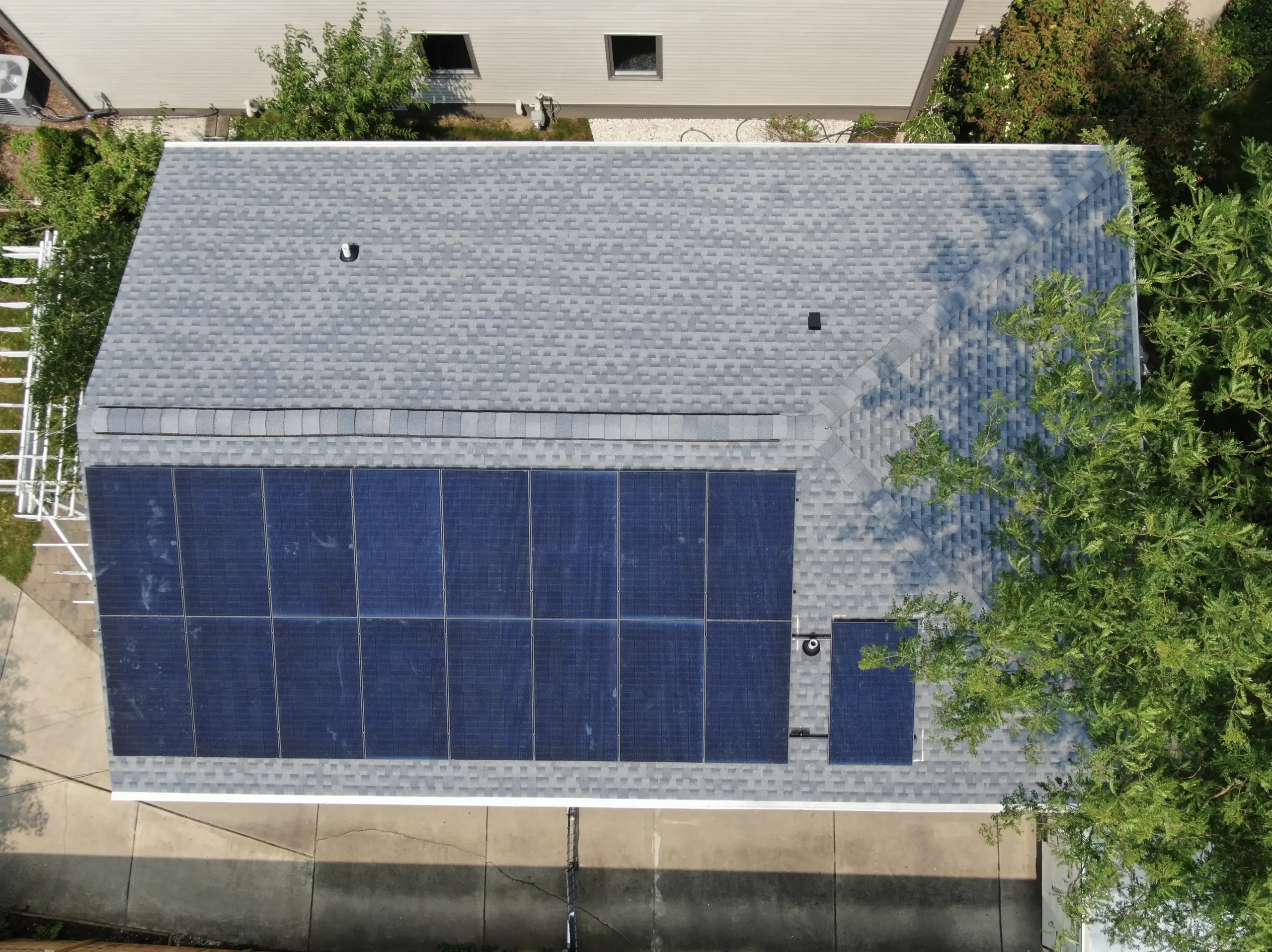 solar panels on side of shingle roof scaled